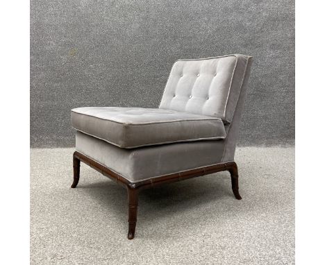 A 20th century 'Slipper' style chair having a square cushioned button back and seat upholstered in grey velour raised on a ca