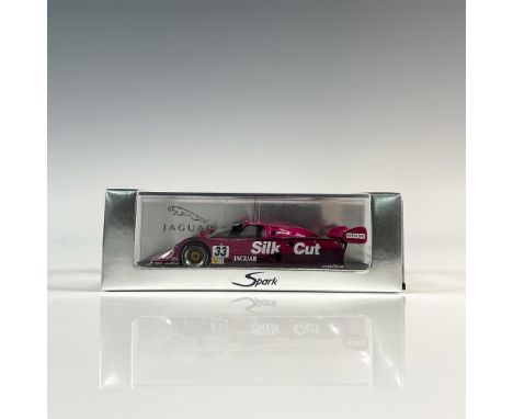 Die-cast metal with plastic parts, 1:43 scale replica of the #33 Formula One racer. Purple exterior with black interior. This