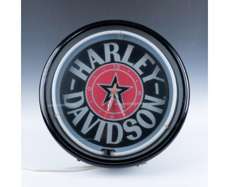 Part of the Roadhouse Collection, clock is colored in black, white and red within black metal case. Neon light bar circles th