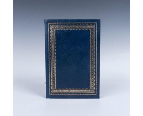 The First Edition Society. A blue leather book with gilded design and gilded edge pages. A novel set most on Loon Lake during
