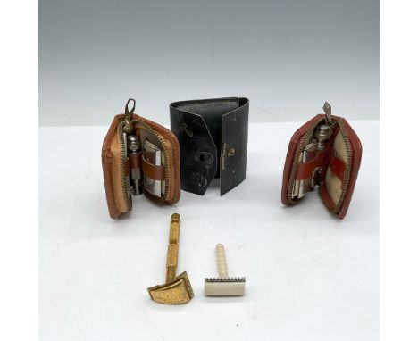 Miniature grooming kits that include shaving razor with additional blades in zippered leather kit. Two brown and 1 black leat