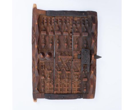 Original Dogon style carved wood granary door that Malians use to protect the window-like opening of a family's grain storage