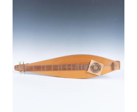 A hand made small wood three-string instrument. Rugg and Jackel Music Company paper label included.Dimensions: 6"L x 2.5"W x 