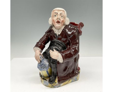 Pottery figure is seated holding his lantern dressed in burgundy coat with black hat. No backstamp but original sellers resea