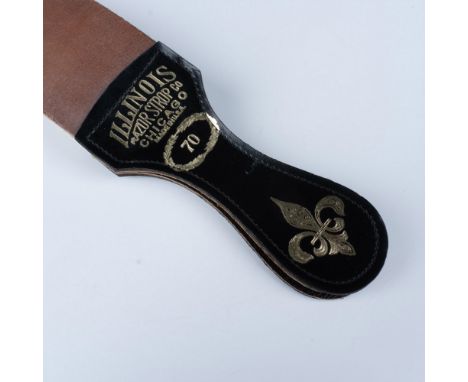 Striking piece used for barbers in the mid 20th century to hone the edge of a straight razor. Made from high quality leather.