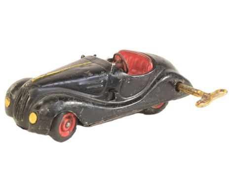 Clockwork Toys - a vintage German Schuco made tinplate clockwork Examico 4001 toy car. Black with red interior, gears and ste