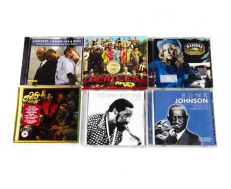 CDs, approximately one hundred and fifty CD albums of various genres with artists including The Beatles, Michael Jackson, Cha