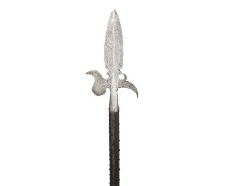 A GERMAN HALBERD, 17TH CENTURY with broad leaf-shaped terminal blade, recurved axe-blade formed with a forward-leaning upper 