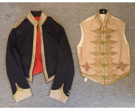 AN OFFICER'S MESS DRESS OF THE 15TH LANCERS, INDIAN ARMY A British officer's blue mess jacket of stable jacket style, with bu