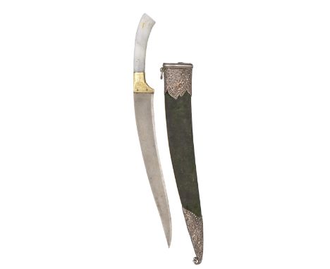 AN INDIAN DAGGER WITH CARVED JADE HILT, LATE 19TH/20TH CENTURY with curved single-edged watered steel blade, engraved silver-