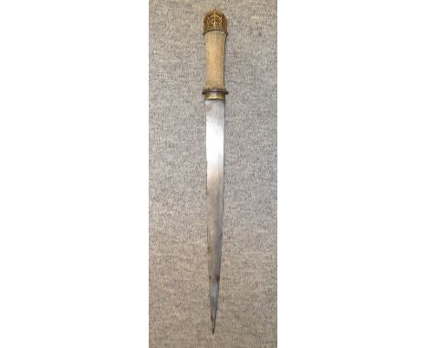 A BHUTANESE DAGGER, LATE 19TH CENTURY with sharply tapering single-edged blade, the hilt with parcel gilt openwork iron pomme