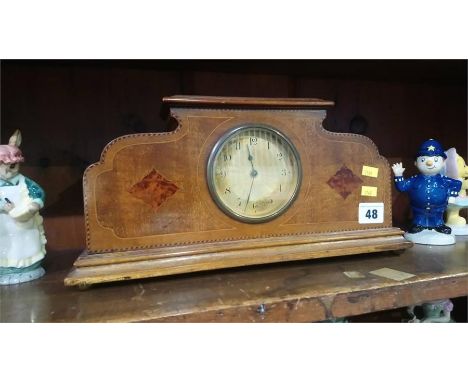 An Edwardian mahogany mantel clock