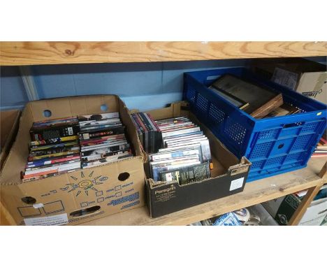Shelf of assorted DVDs and prints