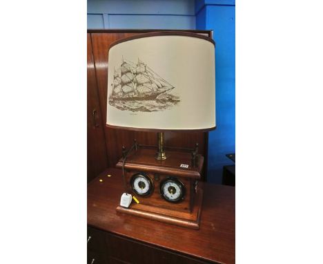 A table lamp and barometer