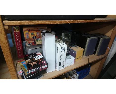 Various radios, DVDs etc. on one shelf