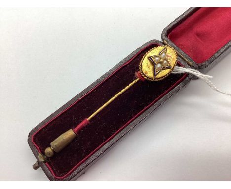 An Edwardian Style Freshwater Pearl and Enamel Stick Pin, the oval panel with ropetwist surround and applied pearl and enamel