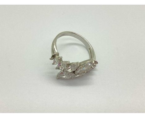 A 14ct White Gold Stone Set Dress Ring, the marquise cut stones claw set throughout (one stone missing), between bifurcated s