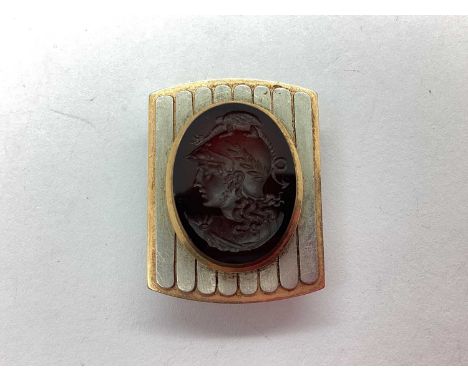 A Roman Intaglio Style Dress Stud, the oval panel carved depicting Roman portrait, set to centre within two-tone gadrooned pa