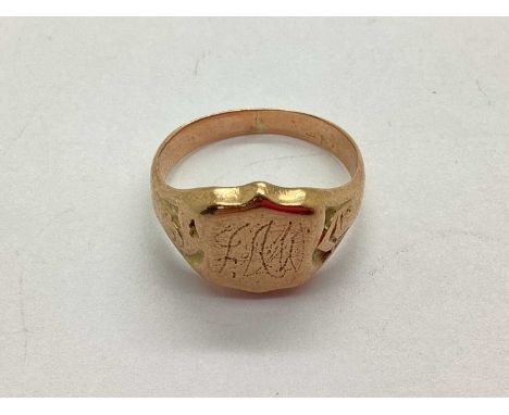 A Gents Signet Ring, with initialled shield shape panel, between wide textured shoulders, stamped "9 .375" (finger size S) (7