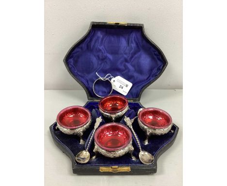 A Victorian Hallmarked Silver Salt Set, H &amp; T, Birmingham 1875, the four matched salt cellars of flowerhead and foliage d