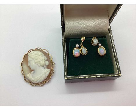 A Pair of 9ct Gold Opal and Diamond Set Earrings, the oval opal collet set to diamond set surmount, together with a single op