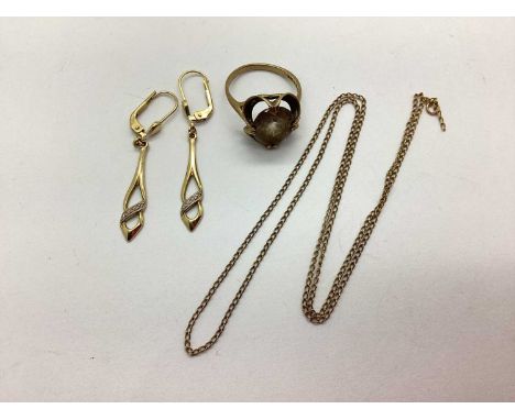 A 9ct Gold Stone Set Modernist Style Ring, the oval stone claw set between Modernist surround of flared style, between unifor