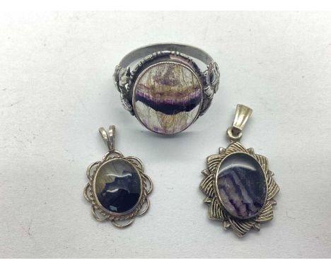 A Blue John Set Dress Ring, of foliage inspired design, the oval panel collet set between flowerhead and leaf detailed should