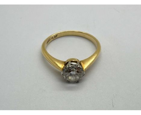 A Single Stone Diamond Ring, the round brilliant cut stone (6mm) claw set, between tapered shoulders, stamped "18CT PLAT" (fi