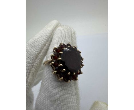 A 9ct Gold Stone Set Cluster Ring, of flowerhead design, claw set throughout between slim tapered band (finger size N).