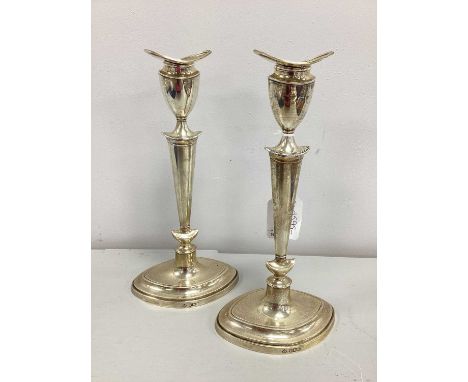 A Pair of Matched Hallmarked Silver Art Deco Candlesticks, JR, Birmingham 1920, each of sinuous tapering form on navette shap