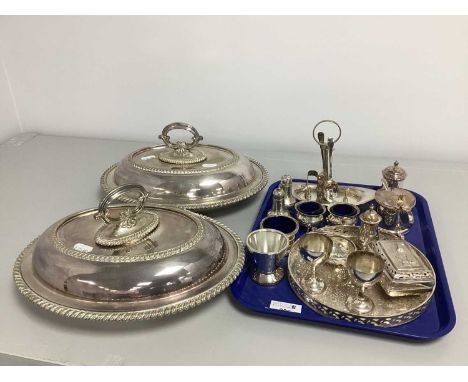 A Pair of Hallmarked Silver Salt and Pepper Shakers, (hallmarks rubbed), of gadrooned form with allover planished finish, on 