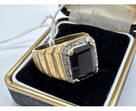 A 9ct Gold Diamond and Stone Set Signet Style Ring, the centre stone four claw set within diamond set border, between wide ta