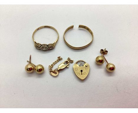 A 9ct Gold CZ Set Ring (finger size O), a 9ct gold wedding band (cut), a 9ct padlock clasp, two pairs of ball studs, stamped 
