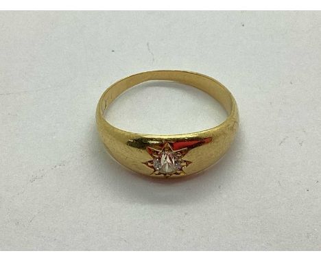 A Single Stone Diamond Ring, the old cut stone star set, within plain tapered band (finger size L1/2) (3.2grams).