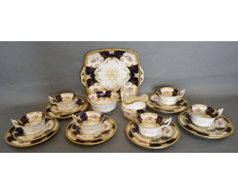 A Coalport Porcelain Tea Service comprising six cups and saucers, side plates, cream jug, sugar bowl and plate, all hand pain