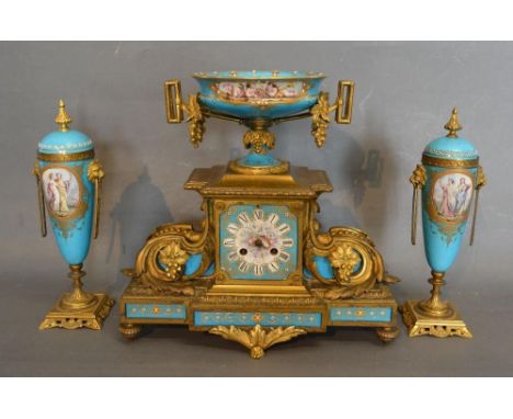 A 19th Century French Ormolu and Porcelain Three Piece Clock Garniture, the clock with porcelain urn surmount hand painted wi