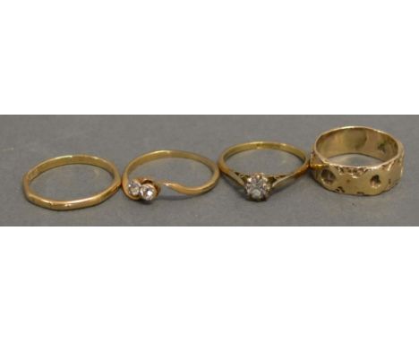 An 18ct. Gold Solitaire Diamond Ring, approximately 0.20ct. together with a Diamond Crossover Ring and two Gold Band Rings, 8