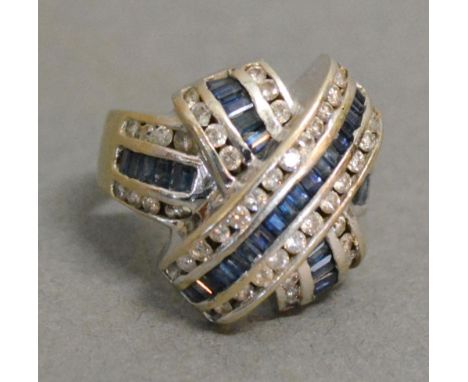 An 18ct. White Gold Diamond and Sapphire Ring set with Tiered Bands of Sapphires and Diamonds 