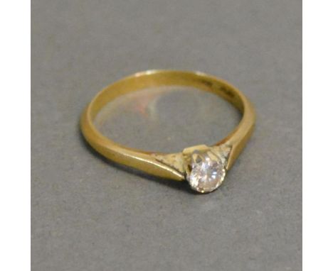 An 18ct. Gold and Platinum Solitaire Diamond Ring 