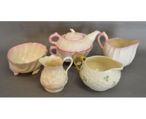 A Belleek Four Piece Tea Service together with two Belleek jugs 
