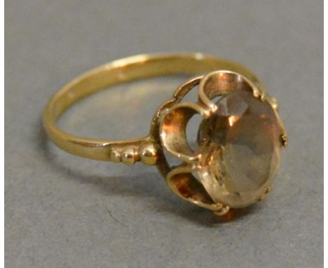 A 9ct. Gold Dress Ring set single Citrine within a pierced setting 