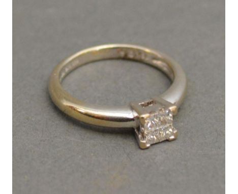 An 18ct. White Gold Diamond Set Ring with four diamonds in the form of a square 