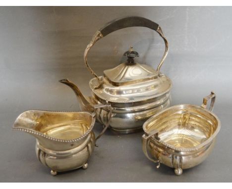 A George V Silver Three Piece Tea Service comprising Teapot, Cream Jug and Two Handled Sucrier, Birmingham 1912 and 1913, mak