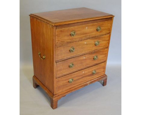 A 19th Century Mahogany Chest of Small Proportions, the moulded top above four drawers with brass handles and with brass carr