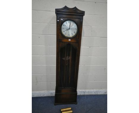 A 20TH CENTURY OAK LONGCASE CLOCK, with a single trunk door, enclosing a 12 inch brass and silvered dial, depicting Arabic nu