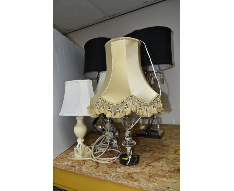 A GROUP OF FIVE TABLE LAMPS comprising two onyx lamps with shades, a pair of glass and chrome effect lamps in a palm style wi
