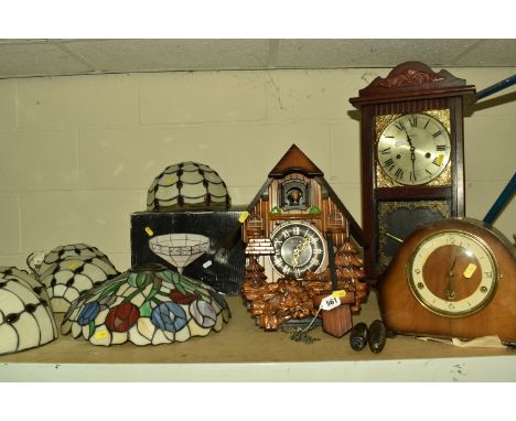 A COLLECTION OF GLASS TIFFANY STYLE LIGHT SHADES AND THREE CLOCKS, comprising a set of seven glass Tiffany/Art Deco style wal