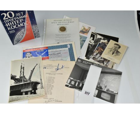 A SELECTION OF RUSSIAN SPACE EXPLORATION EPHEMERA, to include a 20th anniversary 'Inter-Space' booklet, signed to the first p