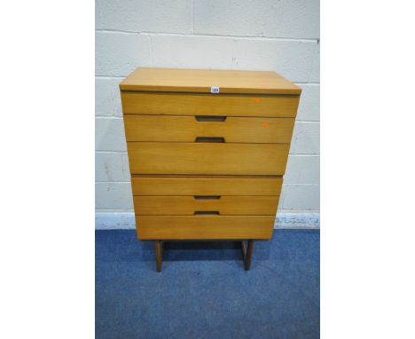 GUNTHER HOFFSTEAD FOR UNIFLEX, A MID CENTURY WALNUT AND TEAK CHEST OF SIX DRAWERS, raised on shaped legs, width 75cm x depth 