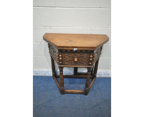 A 20TH CENTURY OAK SIDE TABLE, the fold over top makes the item an octagonal centre table, fitted with a single frieze drawer